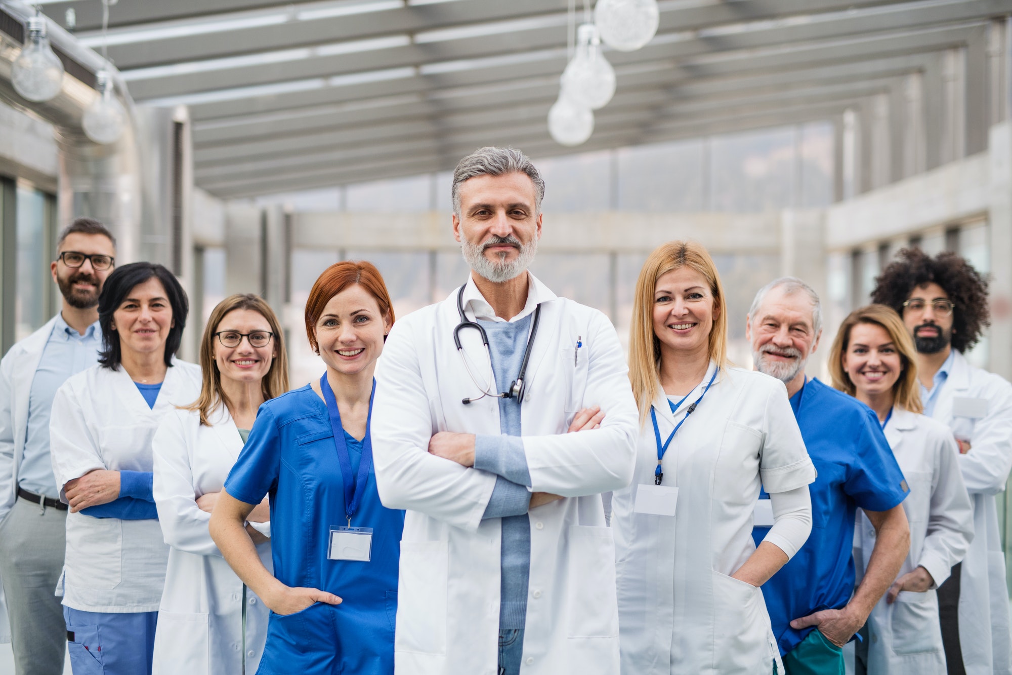 group of doctors standing in hospital on medical conference 